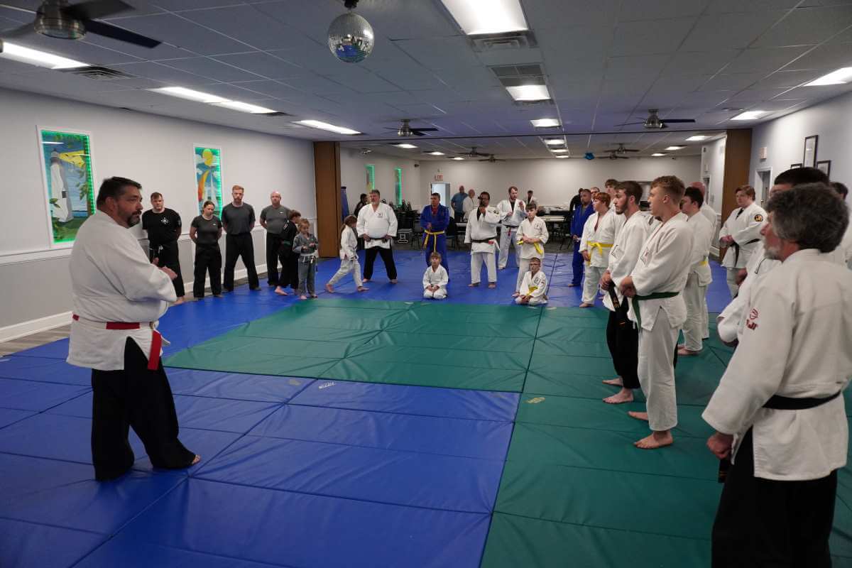 Sensei Will Harris (left) talking about hand to hand combat.
